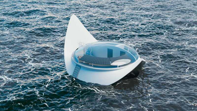 "Conceptual rendering of the Red Sea Home floating on the Red Sea, showcasing its sleek facades and glass envelope reflecting the turquoise waters."
