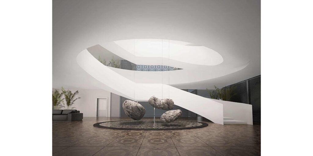 INJ Architects interior rendering of a double height white atrium with a fluid curved form overhead natural boulders arranged around a circular water feature on a patterned stone floor with indoor plants and a patterned tile panel in the background