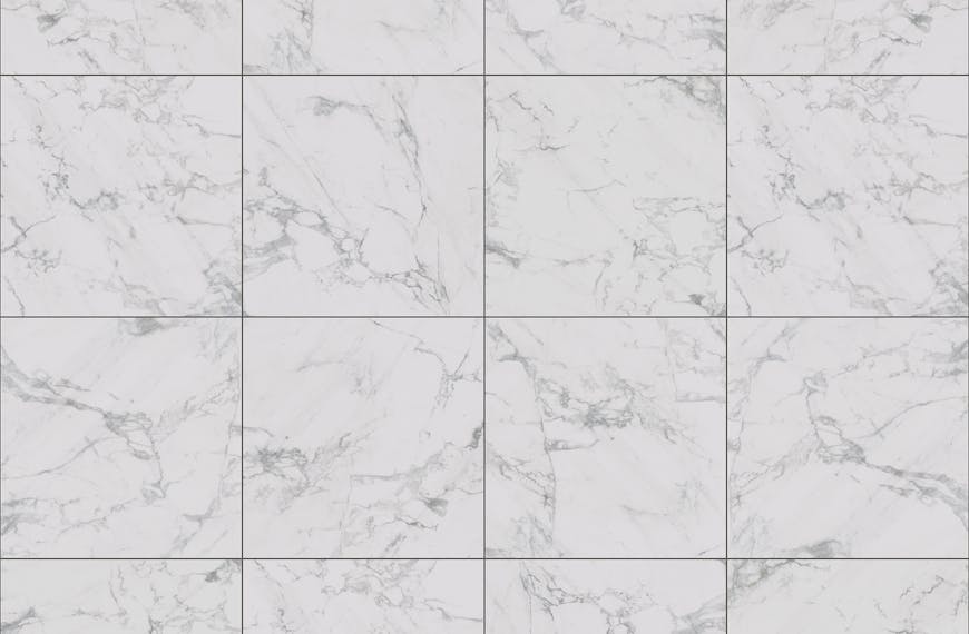 Close-up image of white marble tiles with a natural veined pattern, ideal for interior design.