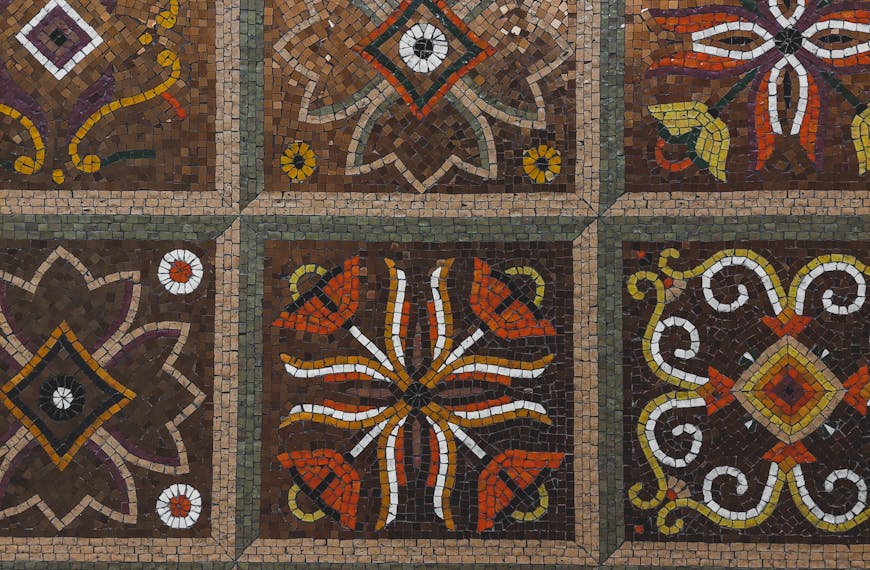 Detailed mosaic pattern with colorful geometric and floral motifs.