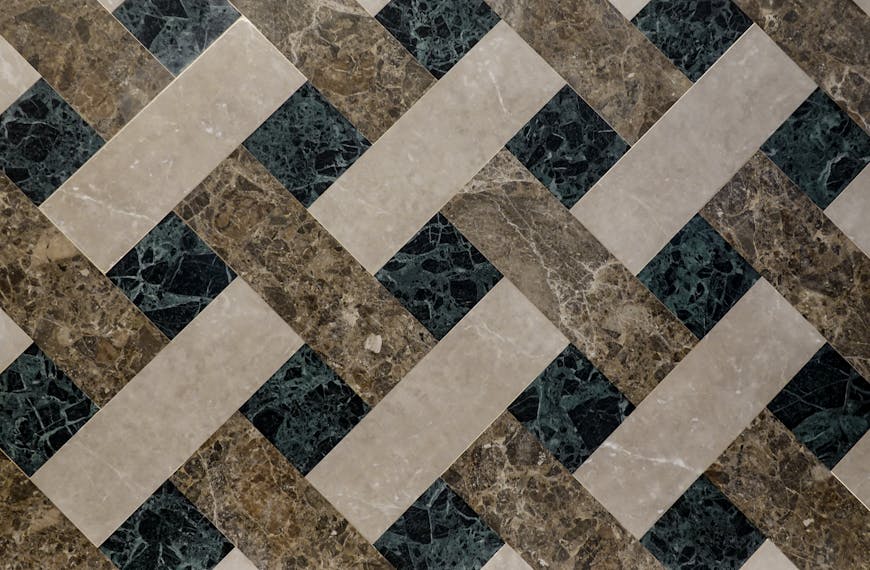 Top view of geometric marble tiles showcasing luxury interior design with intricate patterns.