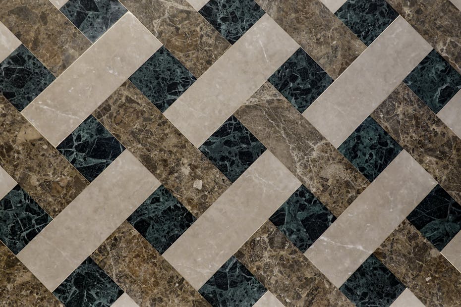 Top view of geometric marble tiles showcasing luxury interior design with intricate patterns.