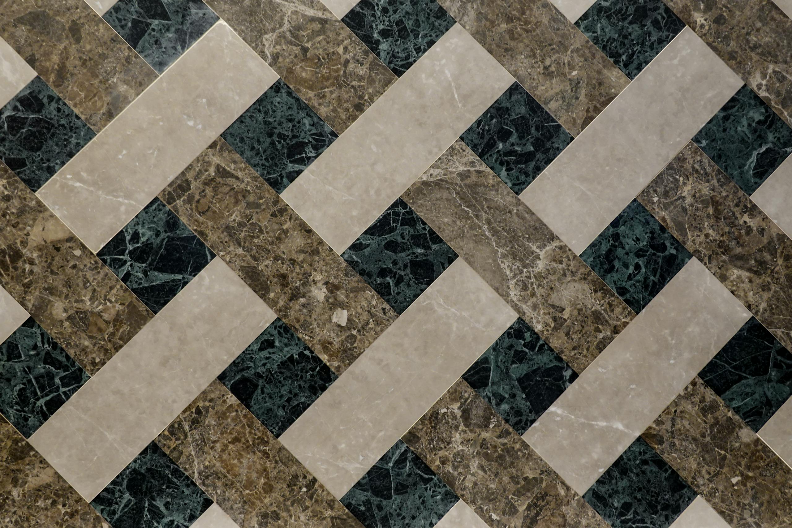 Top view of geometric marble tiles showcasing luxury interior design with intricate patterns.