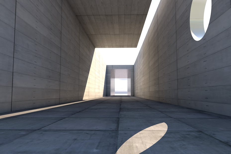 Concrete passage showcasing modern architecture with dramatic light and shadow play.