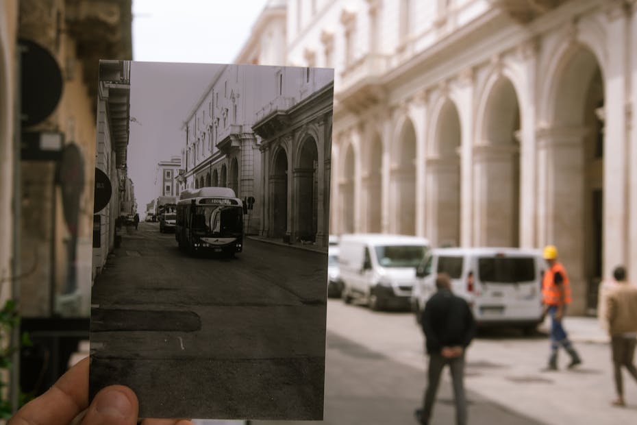 Colorful city street with black and white photo in perspective.