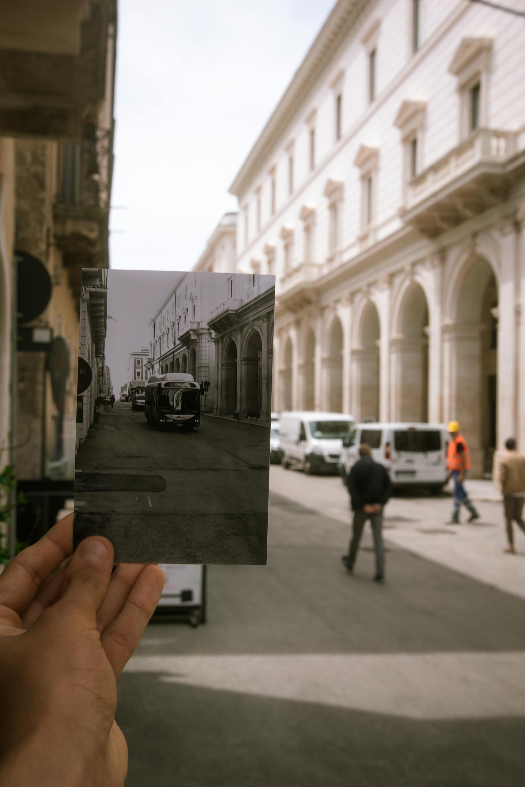 Colorful city street with black and white photo in perspective.