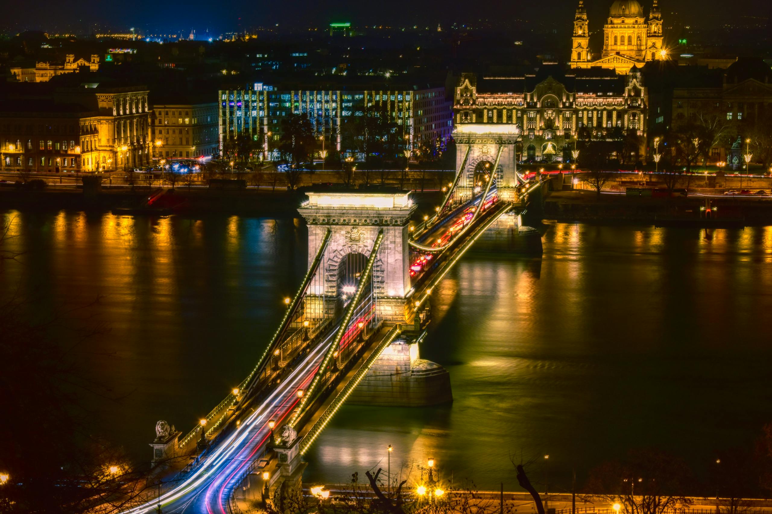 Stunning long exposure night shot of the Széchenyi Chain Bridge, showcasing illuminated architecture and city lights in Budapest.