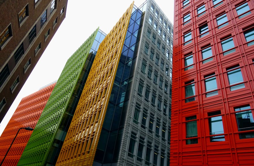 Vibrant colored skyscrapers in a modern cityscape showcasing innovative architecture and design.