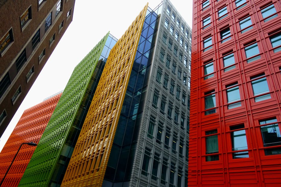 Vibrant colored skyscrapers in a modern cityscape showcasing innovative architecture and design.