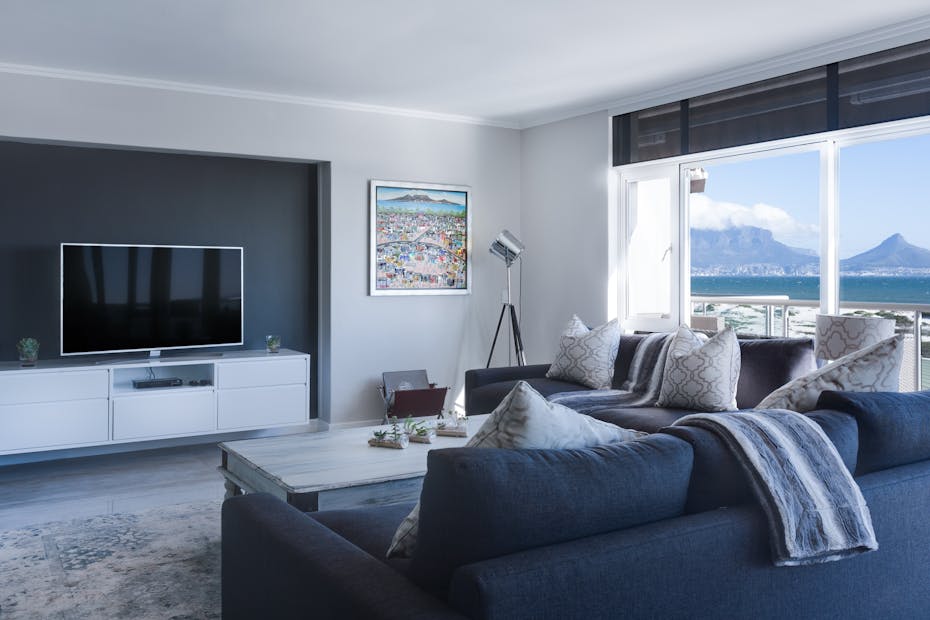 Stylish living room with a view of Table Mountain, blending modern design with natural beauty.