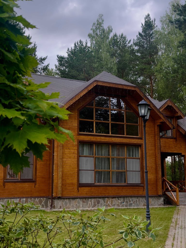 Charming wooden cabin nestled in a lush forest, perfect for nature retreats.