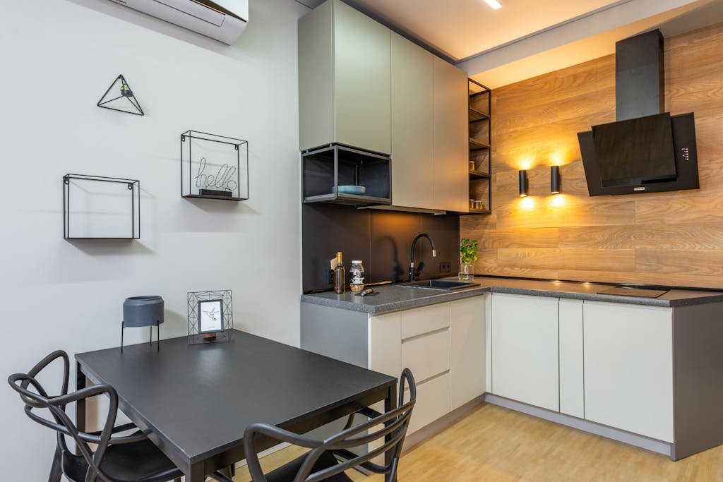 Stylish and modern kitchen interior with contemporary decor and lighting.