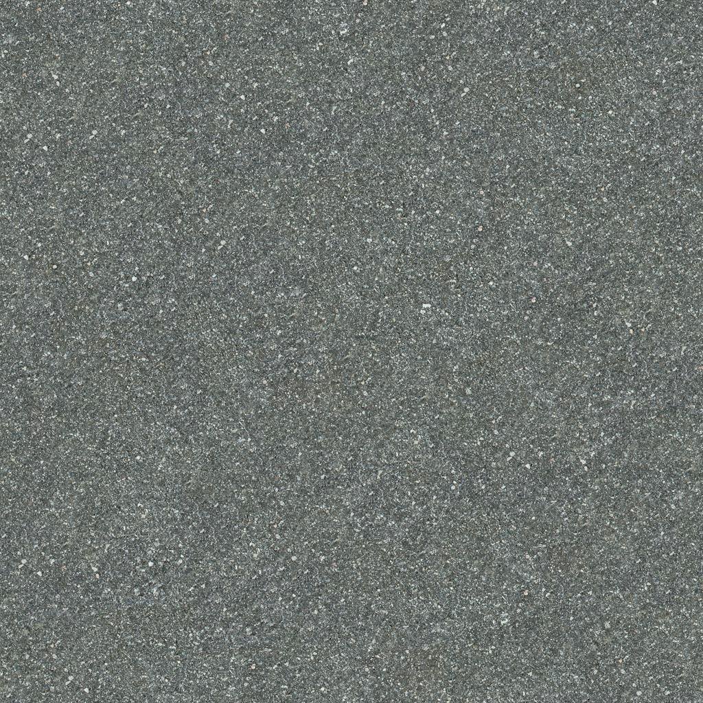 Detailed close-up of rough gray asphalt showcasing its texture and rugged surface.