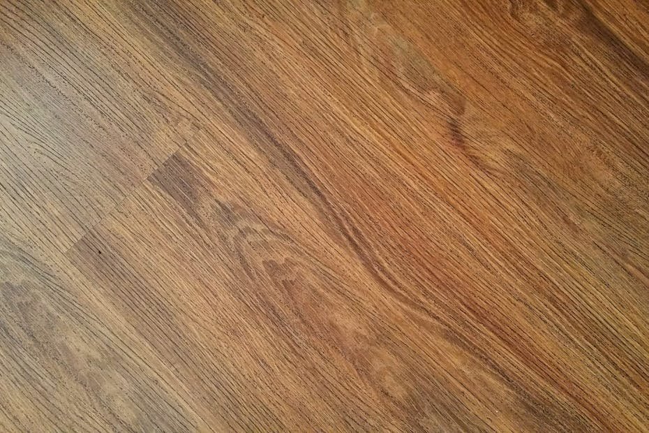 Detailed image of rustic wooden flooring with visible wood grain texture.
