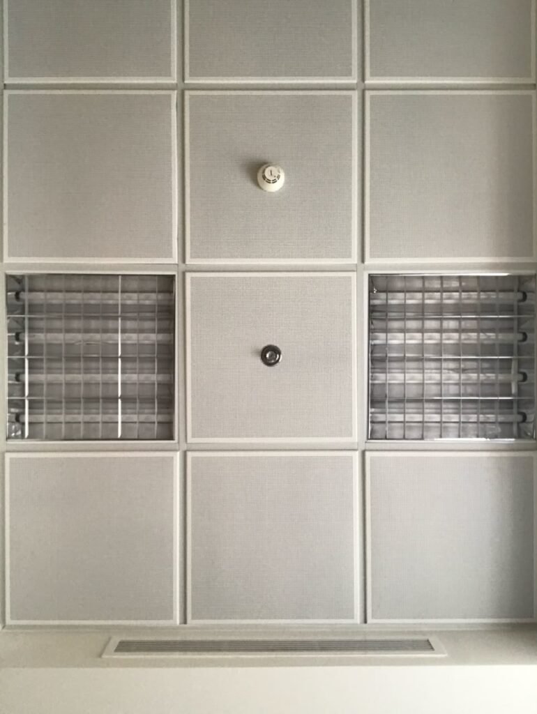 Orthographic ceiling documentation of an office in Jameel Square, Jeddah, Saudi Arabia, showing a modular grid with perforated tiles, louvered light fixtures, and mechanical components.