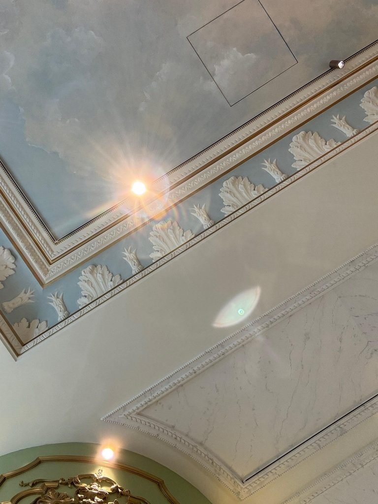 Ceilography — Case 089. Ladurée Tea Room & Bakery, Avenue des Champs-Élysées, Paris, France (2026). Orthographic documentation of a French Second Empire and Classical revival ceiling featuring a painted cloud fresco, gilded stucco cornices, sky-blue relief friezes, and ornamental plaster moldings, as part of the Ceilography architectural research archive.
