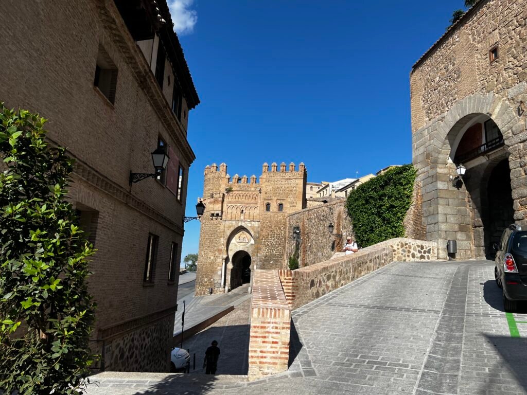 Elevated architectural survey of Toledo, Spain, capturing the high-density urban morphology, historical stone buildings, terracotta roofscapes, and medieval street layout influenced by Andalusian architecture.