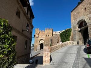 Elevated architectural survey of Toledo, Spain, capturing the high-density urban morphology, historical stone buildings, terracotta roofscapes, and medieval street layout influenced by Andalusian architecture.